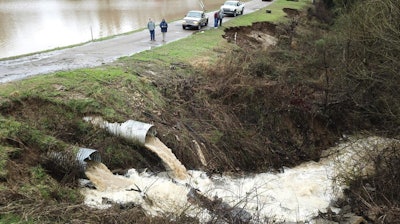 Officials monitor a potential dam/levee failure in the Springridge Place subdivision in Yazoo County, Miss., Feb. 11, 2020.