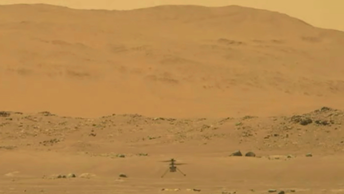 NASA's experimental Mars helicopter Ingenuity lands on the surface of Mars, April 19, 2021.