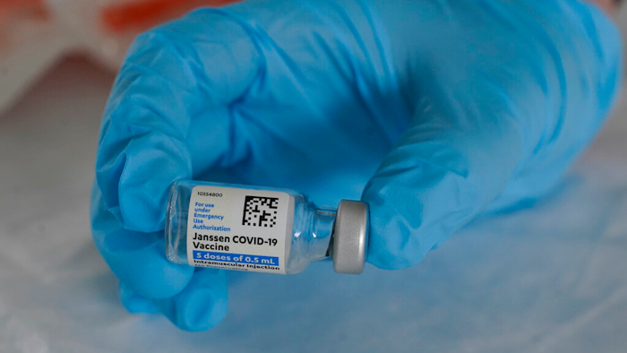 U.S. Army medic Kristen Rogers, of Waxhaw, N.C., holds a vial of the Johnson & Johnson COVID-19 vaccine in North Miami, Fla., March 3, 2021.