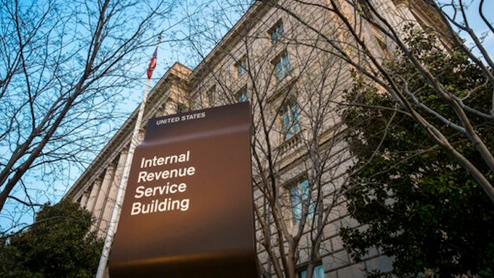 In this April 13, 2014 file photo, the Internal Revenue Service Headquarters (IRS) building is seen in Washington. More than 50 of the largest U.S. companies paid nothing in federal income taxes last year, even though they reported big pretax profits as a group. That's according to the Institute on Taxation and Economic Policy, a group that believes the tax system needs to raise more revenue.
