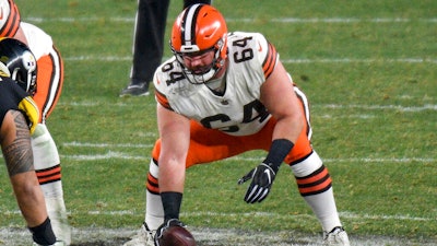 Cleveland Browns center JC Tretter snaps the ball during a playoff game against the Pittsburgh Steelers, Pittsburgh, Jan. 10, 2021.