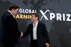 Tesla CEO Elon Musk, left, shakes hands with XPRIZE founder and Executive Chairman Peter Diamandis during the presentation of the XPRIZE for Children's Literacy in Los Angeles, May 15, 2019.