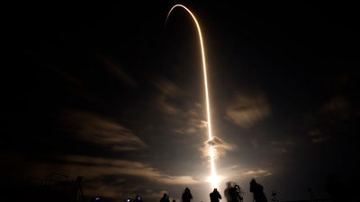 A SpaceX Falcon 9 lifts off in this time exposure from Launch Complex 39A Friday, April 23, 2021, at the Kennedy Space Center in Cape Canaveral, Fla. Four astronauts will fly on the SpaceX Crew-2 mission to the International Space Station.