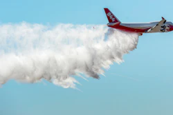 A Boeing 747-400 Global SuperTanker drops half of its 19,400-gallon capacity during a ceremony, Colorado Springs, Colo., May 5, 2016.