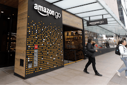 In this file photo, people walk out of an Amazon Go store, in Seattle.
