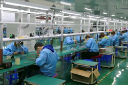 Workers put together electronic gears at a factory in Zhangye in northwestern China's Gansu Province on April 17, 2021. Two surveys show Chinese manufacturing expanded in April but growth appeared to be slowing after a rebound from the coronavirus pandemic.