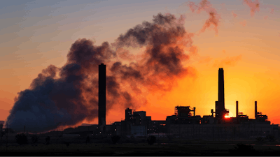 In this file photo, the Dave Johnson coal-fired power plant is silhouetted against the morning sun in Glenrock, Wyoming.