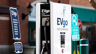 A EVgo electric vehicle charging station is seen at Willow Festival shopping plaza parking lot in Northbrook, Ill., Wednesday, March 31, 2021. President Joe Biden will unveil his $2 trillion infrastructure plan and the proposal calls to build a national network of 500,000 electric vehicle chargers by 2030 and replace 50,000 diesel public transit vehicles.