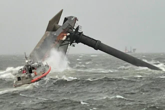 A Coast Guard Station Grand Isle 45-foot Respone Boat-Medium boatcrew heads toward a capsized 175-foot commercial lift boat Tuesday, April 13, 2021, searching for people in the water 8 miles south of Grand Isle, Louisiana.