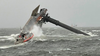 A Coast Guard Station Grand Isle 45-foot Respone Boat-Medium boatcrew heads toward a capsized 175-foot commercial lift boat Tuesday, April 13, 2021, searching for people in the water 8 miles south of Grand Isle, Louisiana.