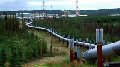 In this undated file photo the Trans-Alaska pipeline and pump station north of Fairbanks, Alaska is shown. Congressional Democrats are moving to reinstate regulations designed to limit potent greenhouse gas emissions from oil and gas fields. It's part of a broader effort by the Biden administration to combat climate change.