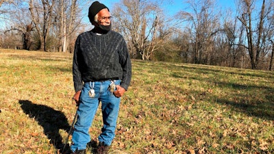 In this Jan. 28, 2021, file photo, Clyde Robinson, 80, speaks with a reporter while standing on his acre-sized parcel of land, in Memphis, Tenn. Robinson is fighting an effort by two companies seeking a piece of his land to build part of an oil pipeline that would run through the Memphis area into north Mississippi. City council members in Memphis, Tenn., are considering a law that could make it more difficult for a company to build an oil pipeline over an aquifer that provides clean drinking water to 1 million people.