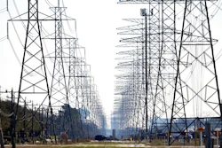 This Tuesday, Feb. 16, 2021 file photo shows power lines in Houston. The Biden administration is taking steps to protect the country’s electric system from cyberattacks through a new 100-day initiative combining federal government agencies and private industry. The initiative was announced Tuesday by the Energy Department.