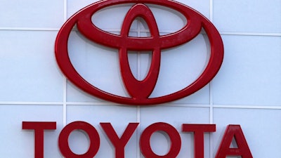 This Aug. 15, 2019 file photo shows the Toyota logo on a dealership in Manchester, N.H. Toyota is recalling nearly 280,000 Venza SUVs in the U.S., Thursday, April 15, 2021, because a wiring problem could stop the side air bags from inflating in a crash. The recall covers Venzas from the 2009 through 2015 model years.