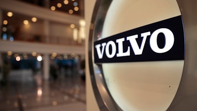 This Feb. 6, 2020 file photo shows The Volvo logo in the lobby of the Volvo corporate headquarters in Brussels. A strike at a Volvo plant in Virginia has ended following a tentative deal between the workers' union and automaker.The UAW Volvo Truck Council said Friday, April 30, 2021, that Volvo Truck workers will be scheduled to return to their regular shifts on Monday.