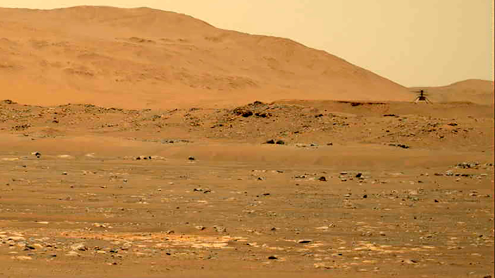 The Mars Ingenuity helicopter, right, flies over the surface of the planet, April 30, 2021.