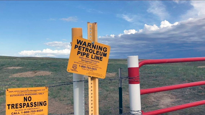 Signs marking the Dakota Access Pipeline are seen north of Cannonball, N.D. and the Standing Rock Reservation on Thursday May 20, 2021.