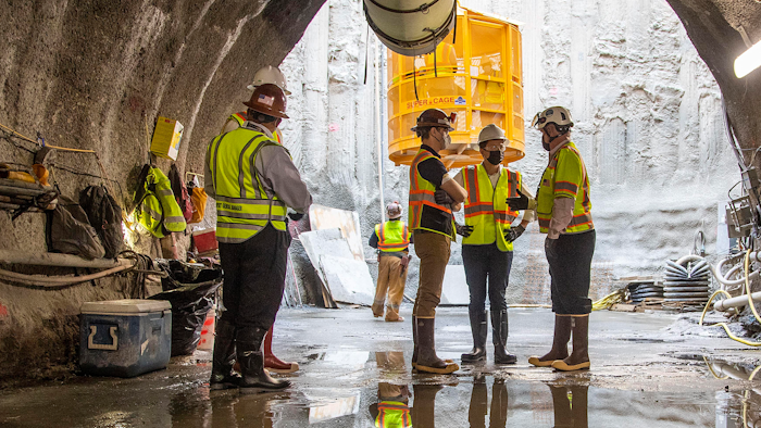 U.S. Secretary of Transportation Pete Buttigieg, center, receives a tour of an underground tunnel for the expansion of the Hartsfield–Jackson Atlanta International Airport plane train tunnel.
