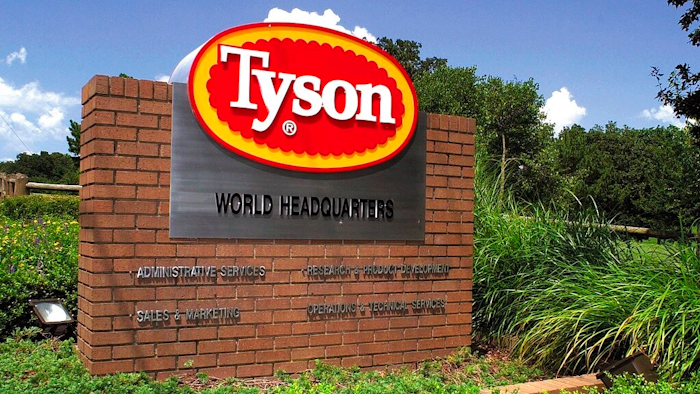 In this July 30, 2001, file photo, a sign marks the entrance to Tyson Foods headquarters in Springdale, Ark. Tyson Foods says it is raising wages to combat absenteeism and worker turnover at its plants as U.S. demand for chicken soars. The Springdale, Arkansas-based company said Monday, May 10, 2021, that absentee rates are around 50% higher than they were before the pandemic.