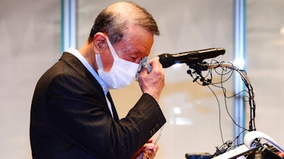 Hong Won-sik, chairman of Namyang Dairy Products, wipes his tears during a press conference at the company's headquarters in Seoul, South Korea on May 4.
