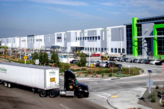 A semi-truck turns into an Amazon Fulfillment center in Eastvale, Calif. on Nov. 12, 2020