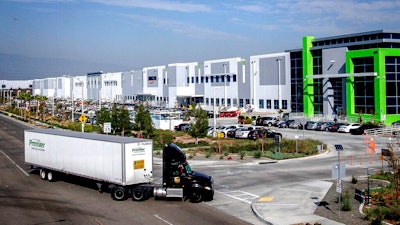 A semi-truck turns into an Amazon Fulfillment center in Eastvale, Calif. on Nov. 12, 2020