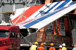 Workers unload debris from Air France flight AF447, Recife, Brazil, June 14, 2009.