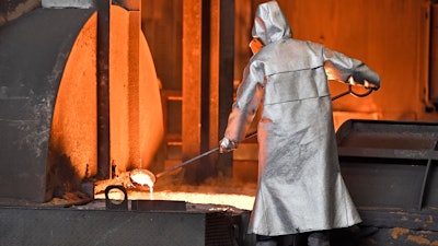 A worker controls iron at the Thyssenkrupp steel factory in Duisburg, Germany, April 27, 2018.