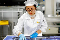 An employee works at a solar panel and equipment factory in Jiujiang, China, Jan. 5, 2021.