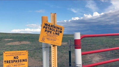 Signs marking the Dakota Access Pipeline are seen north of Cannonball, N.D. and the Standing Rock Reservation on Thursday May 20, 2021.