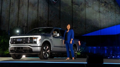 In a photo provided by Ford, Linda Zhang, F-150 Lightning chief engineer, explains details of Ford's first all-electric truck.