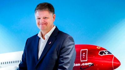 In this Wednesday, Nov. 20, 2019 file photo, Jacob Schram poses for the media after being announced as the new CEO of Norwegian Air Shuttle, in Oslo. Low-cost carrier Norwegian Air Shuttle “has been saved,” top boss CEO Jacob Schram said Wednesday May 26, 2021, adding it had “written history” as the ailing airline had struggled with the fallout of the coronavirus pandemic and a debt restructuring plan.