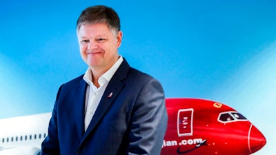In this Wednesday, Nov. 20, 2019 file photo, Jacob Schram poses for the media after being announced as the new CEO of Norwegian Air Shuttle, in Oslo. Low-cost carrier Norwegian Air Shuttle “has been saved,” top boss CEO Jacob Schram said Wednesday May 26, 2021, adding it had “written history” as the ailing airline had struggled with the fallout of the coronavirus pandemic and a debt restructuring plan.