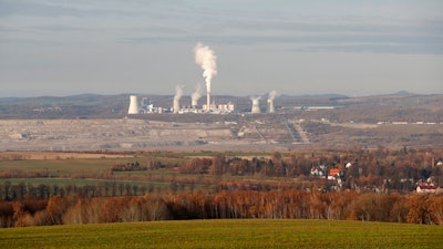 This Tuesday, Nov. 19, 2019 file photo shows the Turow lignite coal mine and Turow power plant near the town of Bogatynia, Poland. European Union's top court has on Friday, May 21, 2021 ordered Poland to immediately stop extracting brown coal at the Turow mine on the border with the Czech Republic and Germany. The Czech Republic filed in March for an injunction, saying the mine drains away water from its inhabited areas.