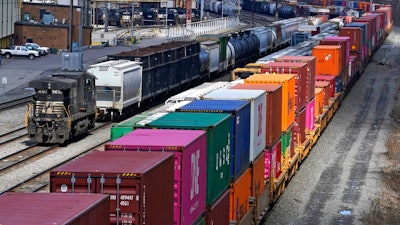 In this April 2, 2021, file photo train consists are formed at Norfolk and Southern Railroad's Conway Yard in Conway, Pa. Even as railroads are operating longer and longer freight trains that can stretch for two miles or more, the companies have drastically reduced staffing levels, prompting unions to warn that moves meant to increase profits could endanger safety and even result in disasters.