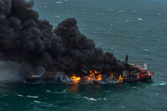 In this photo provided by Sri Lanka Air Force, smoke rises from the container vessel MV X-Press Pearl engulfed in flames off Colombo port, Sri Lanka, Tuesday, May 25, 2021. An explosion occurred Tuesday on a ship anchored off Sri Lanka's capital on which a fire had been burning for several days, prompting the evacuation of all crew members, officials said.