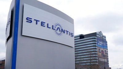 In this file photo taken on Jan. 19, 2021, the Stellantis sign is seen outside the Chrysler Technology Center, Tuesday,, in Auburn Hills, Mich. Carmaker Stellantis and Taiwan’s Foxconn on Tuesday, May 18, 2021, announced plans to develop a jointly operated automotive supplier focusing on technology to make vehicles more connected, including artificial intelligence-based applications and 5-G communications.