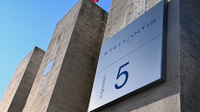 In this file photo, the Stellantis logo is seen on a building of the historic Mirafiori headquarters in Turin, Italy.