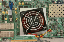 The Morpheus computer processor, inside the square beneath the fan on this circuit board, rapidly and continuously changes its underlying structure to thwart hackers.