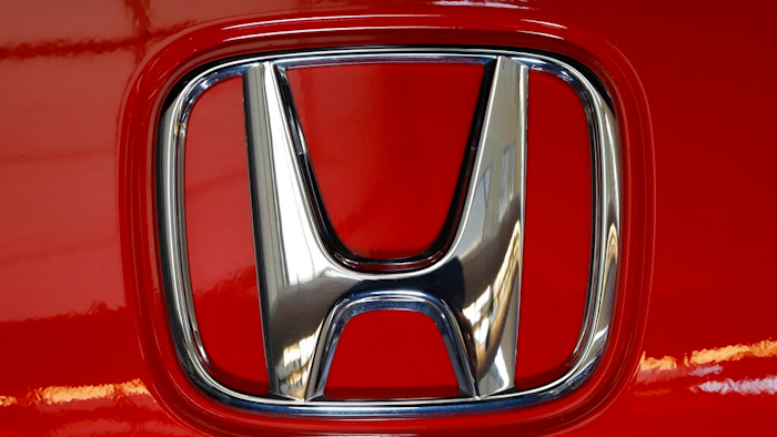 This Thursday, Feb.13, 2020 file photo shows a Honda logo on a vehicle at the 2020 Pittsburgh International Auto Show in Pittsburgh. Although General Motors will build Honda's first two fully electric vehicles for North America, in 2021 the Japanese automaker announced plans to change course and manufacture its own later in the decade.