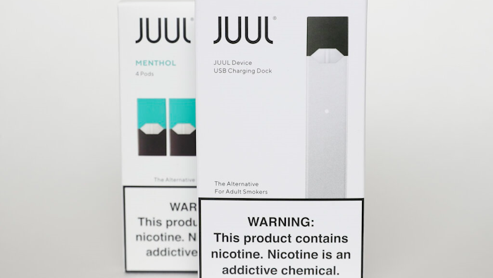 This Tuesday, Feb. 25, 2020 file photo shows packaging for an electronic cigarette and menthol pods from Juul Labs, in Pembroke Pines, Fla. Juul Labs Inc. will pay $40 million to North Carolina and take more action to prevent underage use and sales, according to a landmark legal settlement announced Monday, June 18, 2021, after years of accusations that the company had fueled an explosion in teen vaping.