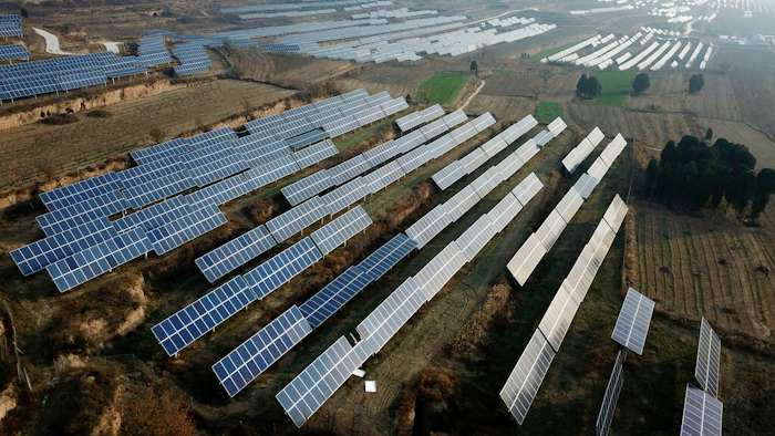 In this Nov. 28, 2019, file photo, a solar panel installation is seen in Ruicheng County in central China's Shanxi Province. China's government on Friday, June 25, 2021 criticized U.S. curbs on imports of solar panel materials that might be made with forced labor as an attack on its development and said Beijing will protect Chinese companies, but gave no details of possible retaliation.