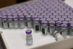 Frozen vials of the Pfizer/BioNTech COVID-19 vaccine are taken out to thaw, MontLegia CHC hospital, Liege, Belgium, Jan. 4, 2021.