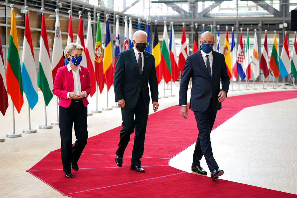 President Joe Biden, center, walks with European Council President Charles Michel, right, and European Commission President Ursula von der Leyen during the United States-European Union Summit at the European Council in Brussels, Tuesday, June 15, 2021.