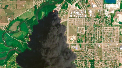 In this Satellite image provided by Planet Labs Inc., a huge plume of smoke and fires can be seen at the Chemtool Inc. plant near Rockton, IL on June 14.