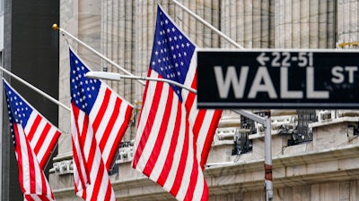 American flags hang outside of the New York Stock Exchange, in this Feb. 16, 2021 photo.