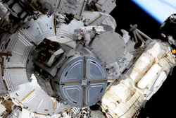 In this image taken from NASA video, French astronaut Thomas Pesquet, top center, and NASA astronaut Shane Kimbrough venture out on a spacewalk, June 16, 2021.