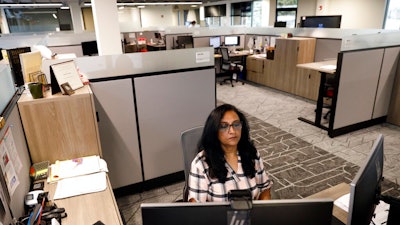 Shobha Surya, associate manager for projects and sales operations of Ajinomoto, a global food and pharmaceutical company, works in a shared office space in Itasca, IL on June 7.