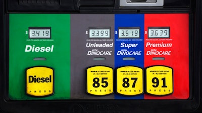 Prices are displayed above the different grades of gasoline available to motorists on May 27 near Cheyenne, Wyo.