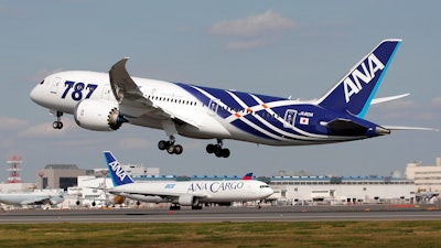 In this file photo, All Nippon Airways Boeing 787 takes off for the airplane's inaugural commercial flight to Hong Kong at Narita International Airport in Narita, east of Tokyo.